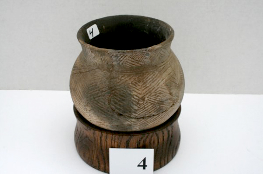 5 3/8-inch by 5-inch pot with incised triangle designs. From the Hays Place near Blue Lake, Arkansas. Estimate $40-$500. Image courtesy LiveAuctioneers.com and Old Barn Auction.