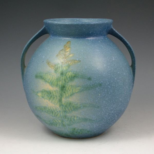 This blue vase with fern decoration belongs to Roseville's Windsor line, introduced in 1921. Image courtesy Belhorn Auction Services.