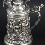 Silver tankard with ornate decoration, 10 inches tall, 43.9 troy oz. total weight. Estimate $5,000-$7,000. Image courtesy Kaminski Auctions.