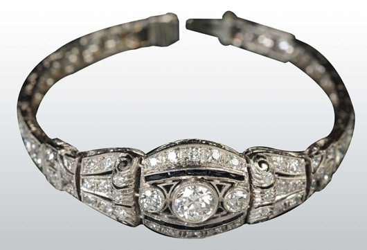 Platinum bracelet containing 3.4-carat center diamond and 65 European-cut diamonds, plus 10 sapphire baguettes. Estimate $3,000-$5,000.
