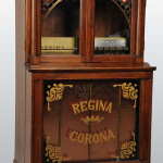 Orchestral Corona Regina Style 34 music changer in oak case. Holds 12 discs. Estimate $10,000-$14,000.