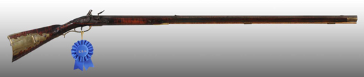 J.P. Beck (northern Lancaster County, Pa.) rifle made around 1785-1790 with the blue ribbon it won for best relief carving at Kentucky Rifle Association's Kentucky Rifle Show. Estimate $20,000-$40,000.