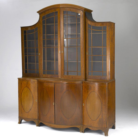 A serpentine front and inlaid mahogany enhance this English Regency breakfront, which is estimated at $3,000-$4,000. Image Courtesy Rago Arts and Auction Center.