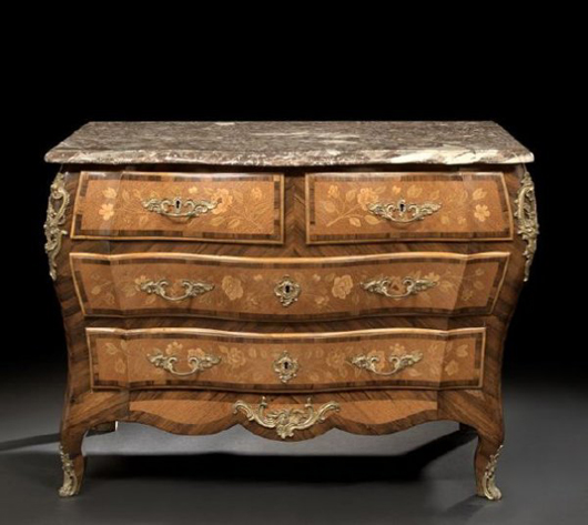 Dating to the third quarter of the 19th century, this Louis XV-style rosewood and kingwood commode has a shaped Breche Arlequino (Italian) marble top. The drawers  are banded and have floral exotic wood inlays. Image courtesy New Orleans Auction Galleries.