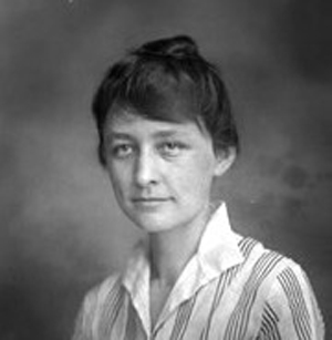 Public domain image of Georgia O'Keeffe during her time at the University of Virginia, where she was a teaching assistant. Photo was taken on July 19, 1915 by Rufus W. Holsinger (1866?-1930). Courtesy Wikipedia.