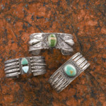 Wide silver bracelets with curio trade stamping and turquoise sold for $587.50 in Cowan's American Indian and Western Art Auction on April 4. Image courtesy Cowan's.