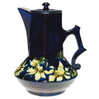 Pauline Pottery made pieces in the Limoges style. The shape of the scattered flowers and their shaded yellow color resemble the decorations on French pottery. The 8-inch teapot sold for $570 at a Cincinnati Art Galleries auction.