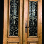Wrought iron panels accent these mid-1800s pine entry doors from Europe. The pair has a $2,000-$3,000 estimate. Image courtesy Jackson's.