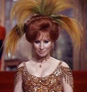 Barbra Streisand in her immortal lead role in the film Hello Dolly. Public domain image from the movie's 1969 trailer.