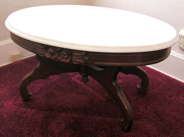 Surely this is a mid-19th century Rococo Revival coffee table. Sorry. It was recently made in Montgomery, Ala., by Pelham, Shell, & Leckie Company.