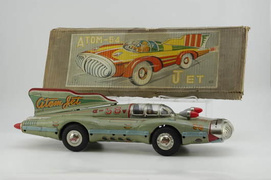 Postwar Atom Jet racer by Yonezawa, 26½ inches long with futuristic styling and extremely rare original box that may be the only one in existence displaying this particular design variation. Estimate $4,000-$6,000.
