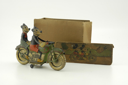 Tippco tin clockwork Mickey and Minnie Mouse on Motorcycle, early 1930s, the only known example with its original pictorial box. Estimate $40,000-$50,000.