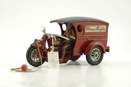 Circa-1930s Hubley Flower Shoppe Indian motorcycle delivery van, cast iron, with original factory paint in red as opposed to the more frequently seen blue. Attributed as a private-label production. Retains original paper label marked “Flower Shoppe Inc.” Ex Covert Hegarty Collection. Estimate $35,000-$45,000.