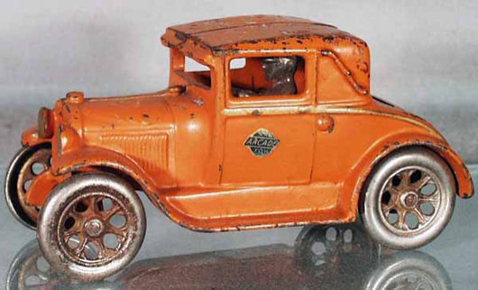 What makes this Arcade 106 Ford Coupe unusual is its original orange paint job. The 6 1/2-inch car has a $200-$300 estimate. Image courtesy Lloyd Ralston Gallery.