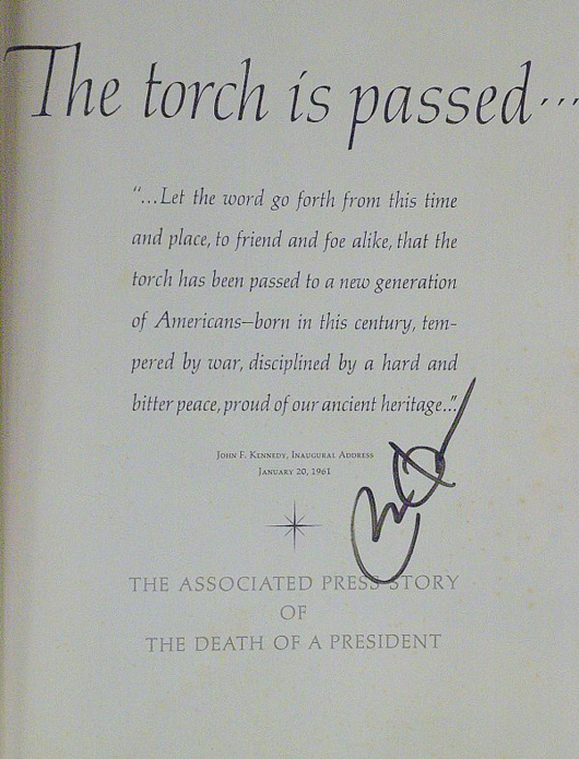 Barack Obama signed the title page of the book ‘The Torch Is Passed,' a compilation of Associated Press stories relating to the death and funeral of John F. Kennedy. It has a $2,500-$4,500 estimate. Image courtesy Written Word Autographs.