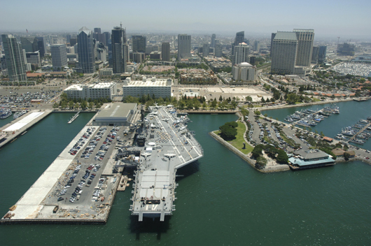 USS Midway with San Diego skyline in background. Image courtesy of USS Midway Museum.