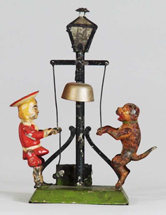 Buster Brown and Tige with lamppost tin toy in fine condition, estimate $4,500-$6,500. Image courtesy RSL Auction.