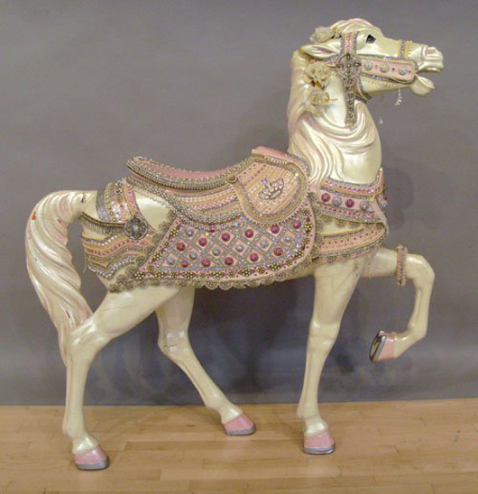 Hand-carved around the turn of the 20th century, this carousel horse has recent repaint. It carries an $800-$1,200 estimate. Image courtesy Pook and Pook Inc.