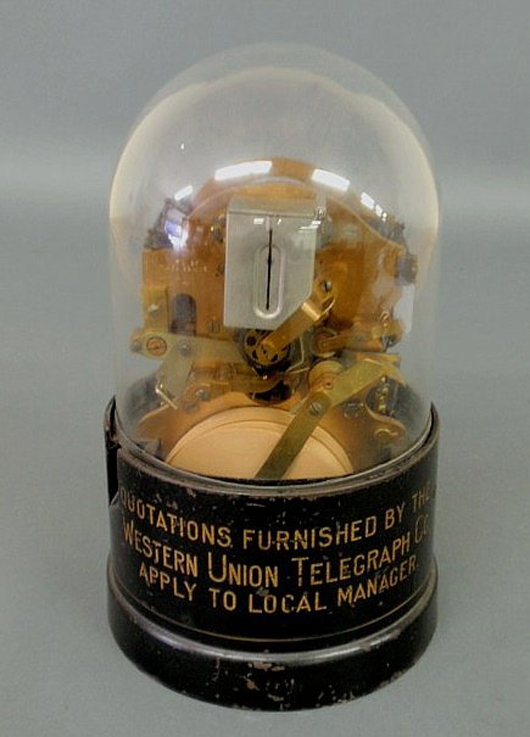 T.A. Edison Inc. produced this Western Union stock ticker late in the late 1800s. With its original glass dome the device stands 13 inches high. Image courtesy Wiederseim Associates Inc.