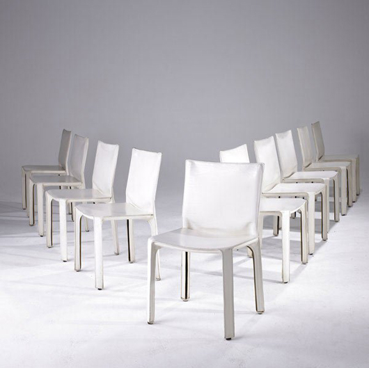 Ten of Mario Bellini's Cassina Cab chairs carry a $4,000-$6,000 estimate. The chairs are upholstered in stitched white leather. Image courtesy Sollo Rago.