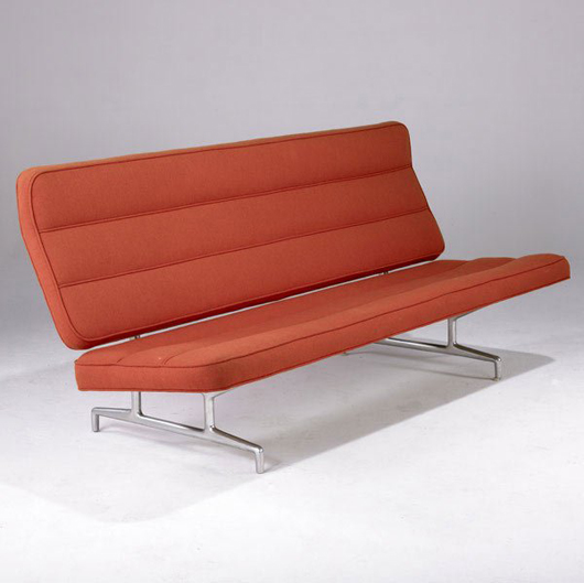 Herman Miller manufactured Charles and Ray Eames' Aluminum Group sofa. This example retains its original orange hopsack upholstery. Nearly 6 feet long, the sofa has a $2,000-$4,000 estimate. Image courtesy Sollo Rago.