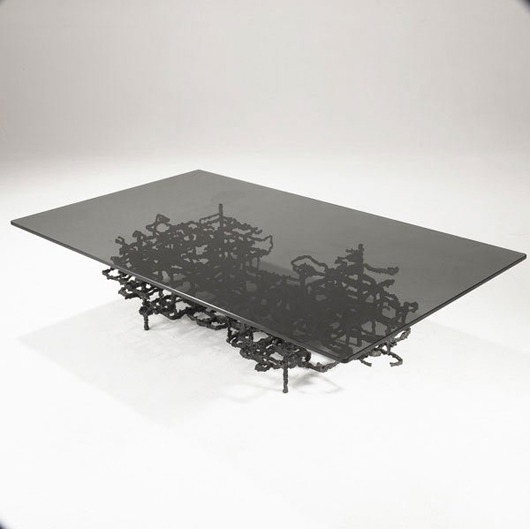 The smoked plate glass top on this Ibram Lassaw cocktail table measures 60 by 36 inches. It has a $4,000-$6,000 estimate. Image courtesy Sollo Rago.