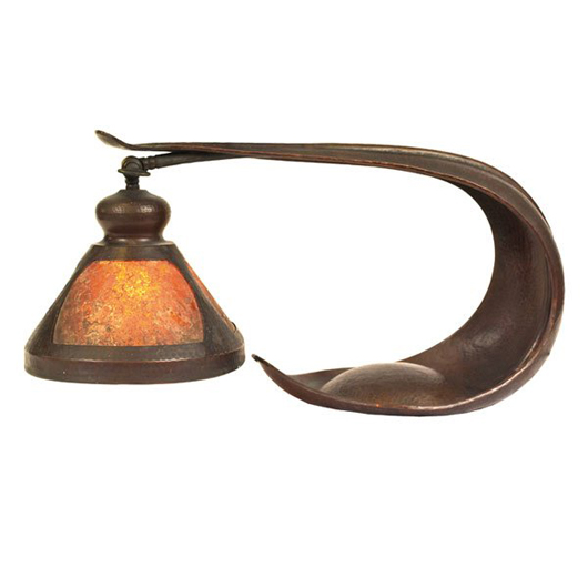 Benedict Studios' distinctive cobra lamp of copper with a mica shade is 22 inches wide by 10 1/2 inches high. It has a $2,500-$3,500 estimate. Image courtesy Treadway Toomey Galleries.