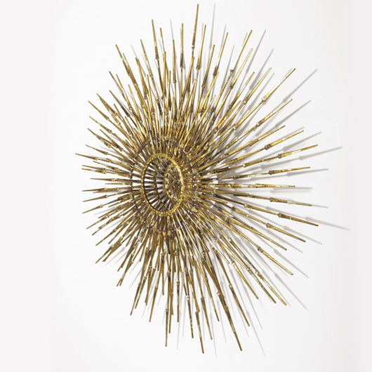 Steel nails with gold and silver leaf finish were joined to create a radiating sculpture in the style of Curtis Jere. More than 34 inches in diameter, the sculpture has bronze welds. It raised $1,952. Image courtesy Sollo Rago.