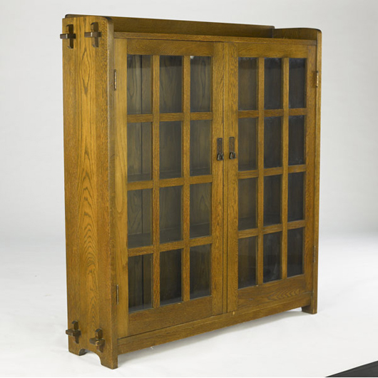L. & J.G. Stickley two-door bookcase (no. 645) with 12 panes per door, gallery top and keyed-through tenons, unmarked, 55¼ inches by 51 inches, estimate $3,750-$4,750. Image courtesy Rago’s.