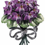 This costume jewelry pin that looks like a bouquet of violets was made by Mazer. The flowers are white metal covered with purple and green enamel. The 3-inch pin sold for $58 at a Morphy Auction in Denver, Pa.