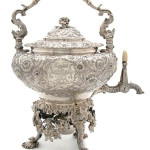 London silversmiths Storr & Mortimer crafted this George IV hot water kettle on stand in 1827. The body is decorated in floral repousse and engraved armorial crests. The kettle weighs 139 troy ounces. Image courtesy Leslie Hindman Auctioneers Inc.