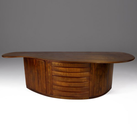This Wharton Esherick buffet is signed 'W.E. 1969.' The sculpted walnut top is 117 inches long. This rare piece has a $280,000-$380,000 estimate. Image courtesy of Sollo Rago Modern Auctions.