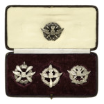 Four Russian pilots' badges and leather box with Imperial Russian Coat of Arms, estimated to sell for $5/7000 in Cowan’s Nov. 4, 2009 Fall Firearms and Early Militaria Auction.