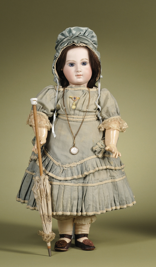 Portrait Jumeau bebe, so called 'Elizabeth' doll, circa-1880, France, 23 inches, pressed-bisque socket head, fully jointed composition body marked Jumeau, Au Nain Blue store label, original signed E. Jumeau brown leather shoes. Estimate $10,000-12,000. Image courtesy Skinner Inc.