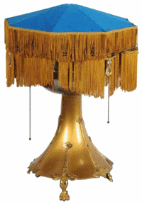 This is more than a lamp. Hiding under the fringed lampshade is a disc phonograph. This vintage table lamp sold for $1,200 at Morphy Auctions in Denver, Pa.