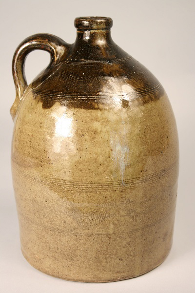 This Sand Mountain, Ala., double-dipped alkaline glazed jug with combed sine wave incising, sold for $3,632. Image courtesy Case Antiques.
