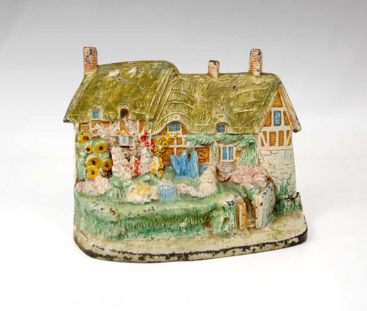 A collection of cast-iron doorstops, including this Anne Hathaway Cottage by Hubley, is from a West Orange, N.J., estate. Image courtesy of Stephenson's Auction.