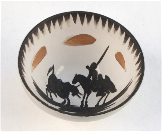 Pablo Picasso's fascination with bull fighting is conveyed in this pottery bowl, which is  signed and stamped  ‘Edition Picasso Madoura.' The 5-inch-diameter bowl has a $1,000-$1,500 estimate. Image courtesy of Susanin's.