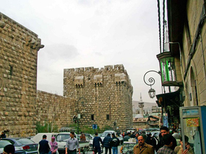 Syria is a nation of archaeological treasures. Its capital city, Damascus, is the oldest continuously inhabited city in the world, with civilization documented as early as 10,000 B.C. Shown here is a street in Old Damascus. Image courtesy Wikimedia Commons.