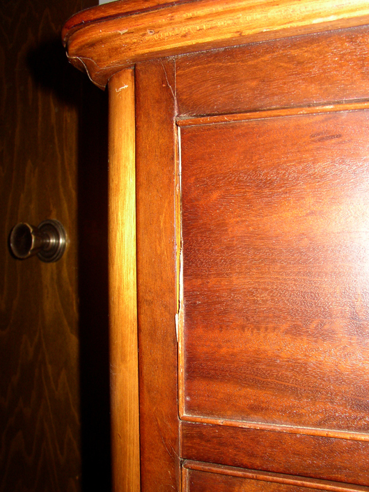 The edge beading is broken off this drawer front. Your eye may have missed it but your fingers would have found it.