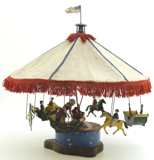 Merry-go-round attributed to Althof Bergmann (American), cloth canopy, tin figures, 18 inches by 18 inches. Estimate $8,000-$10,000. Image courtesy Bertoia Auctions.
