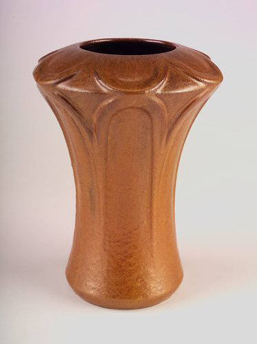 Fulper's Copperdust crystalline glaze covers a rare corseted vase with floriform top. The 11 1/2-inch vase has a vertical raised mark. Image courtesy of Rago Arts and Auction Center and LiveAuctioneers Archive.