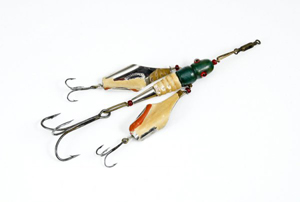 The Comstock Flying Hellgrammite, patented June 30, 1883, may be the first wooden bait. This rare example has a $4,000-$6,000 estimate. Image courtesy of Lang's Sporting Collectibles Inc.