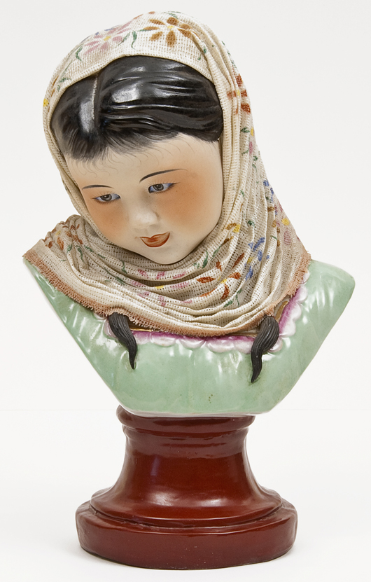 Porcelain propaganda bust of peasant girl, circa 1960, glazed lace headscarf, approx. 13 inches high, estimate $4,900-$6,500. Image courtesy Bloomsbury Auctions.