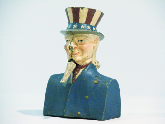 Painted cast-iron Uncle Sam bust-style mechanical bank with 'jiggling' goatee, attributed to Ives, Blakeslee, $17,625.