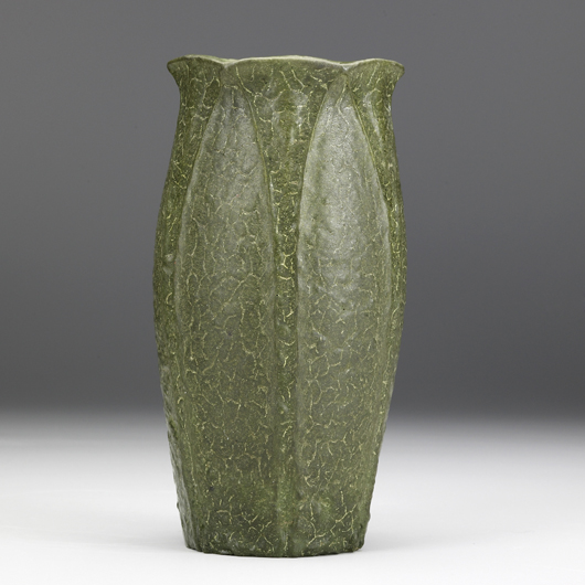To be sold in January, a Grueby vase decorated by Ruth Erickson has an alternating pattern of leaves and buds covered with a thick green glaze (estimate $4000-6500). Courtesy Rago Arts and Auction Center
