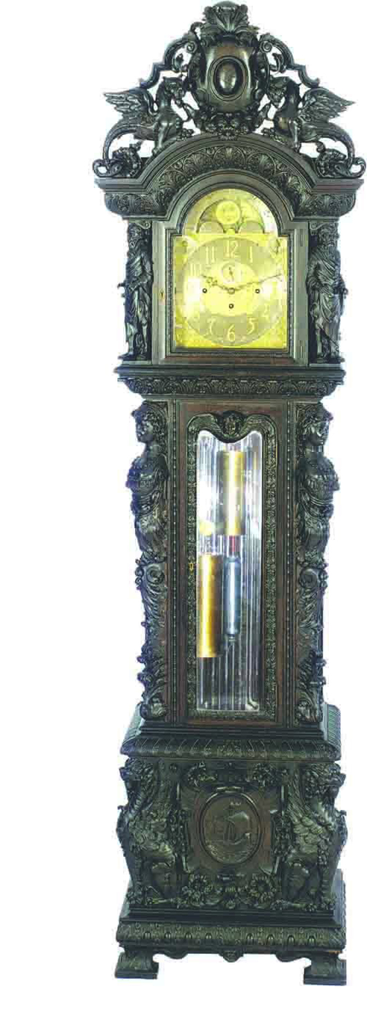 Crisp and detailed carving covers the oak case of this clock produced by Tobey Furniture Co. of Chicago at the turn of the 20th century. It stands 112 inches high and has a $45,000-$75,000 estimate. Image courtesy of Bob Courtney Auctions.