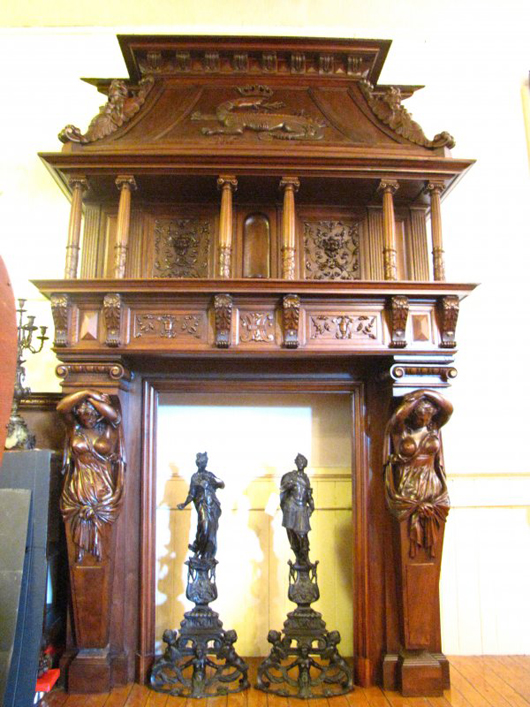 Crisp and detailed carving covers the oak case of this clock produced by Tobey Furniture Co. of Chicago at the turn of the 20th century. It stands 112 inches high and has a $45,000-$75,000 estimate. Image courtesy of Bob Courtney Auctions.