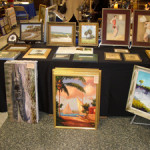 Two 1930s watercolor pinups at top right and a Donald Rust alligator on the left bracket various works by Highwaymen and other artists in Bob LeBlanc’s booth.
