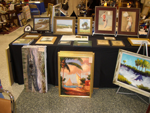 Two 1930s watercolor pinups at top right and a Donald Rust alligator on the left bracket various works by Highwaymen and other artists in Bob LeBlanc’s booth.